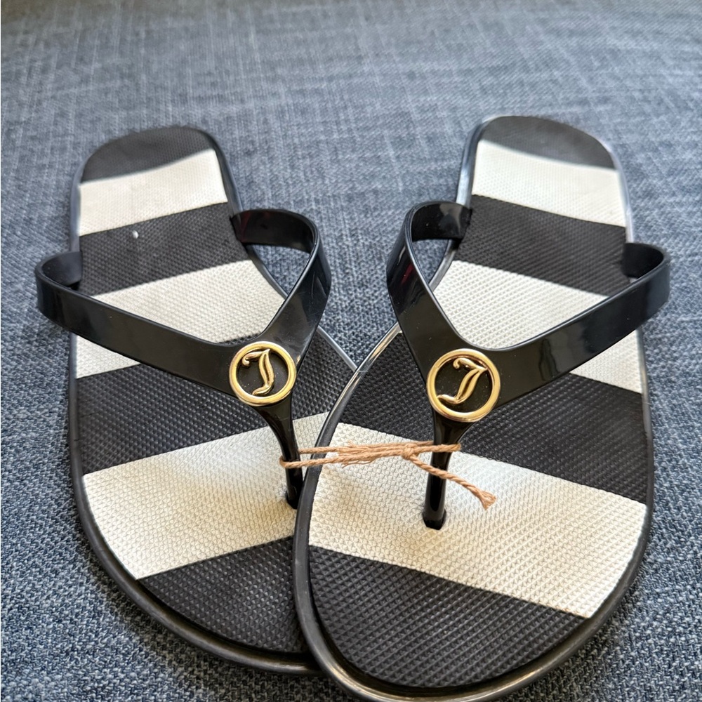 Juicy Couture size medium, barely‎ used black and white stripe flip-flop.